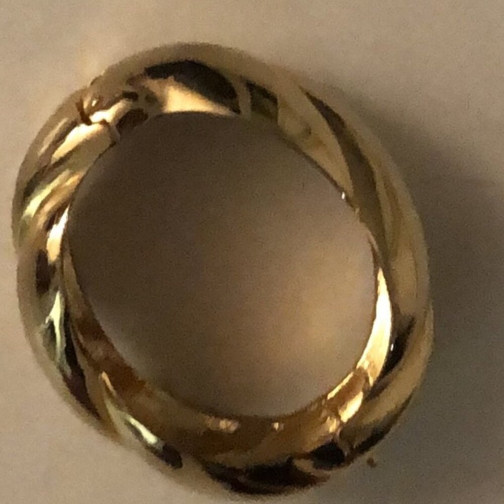 One golden heavy bracelet with a clasp to open it
